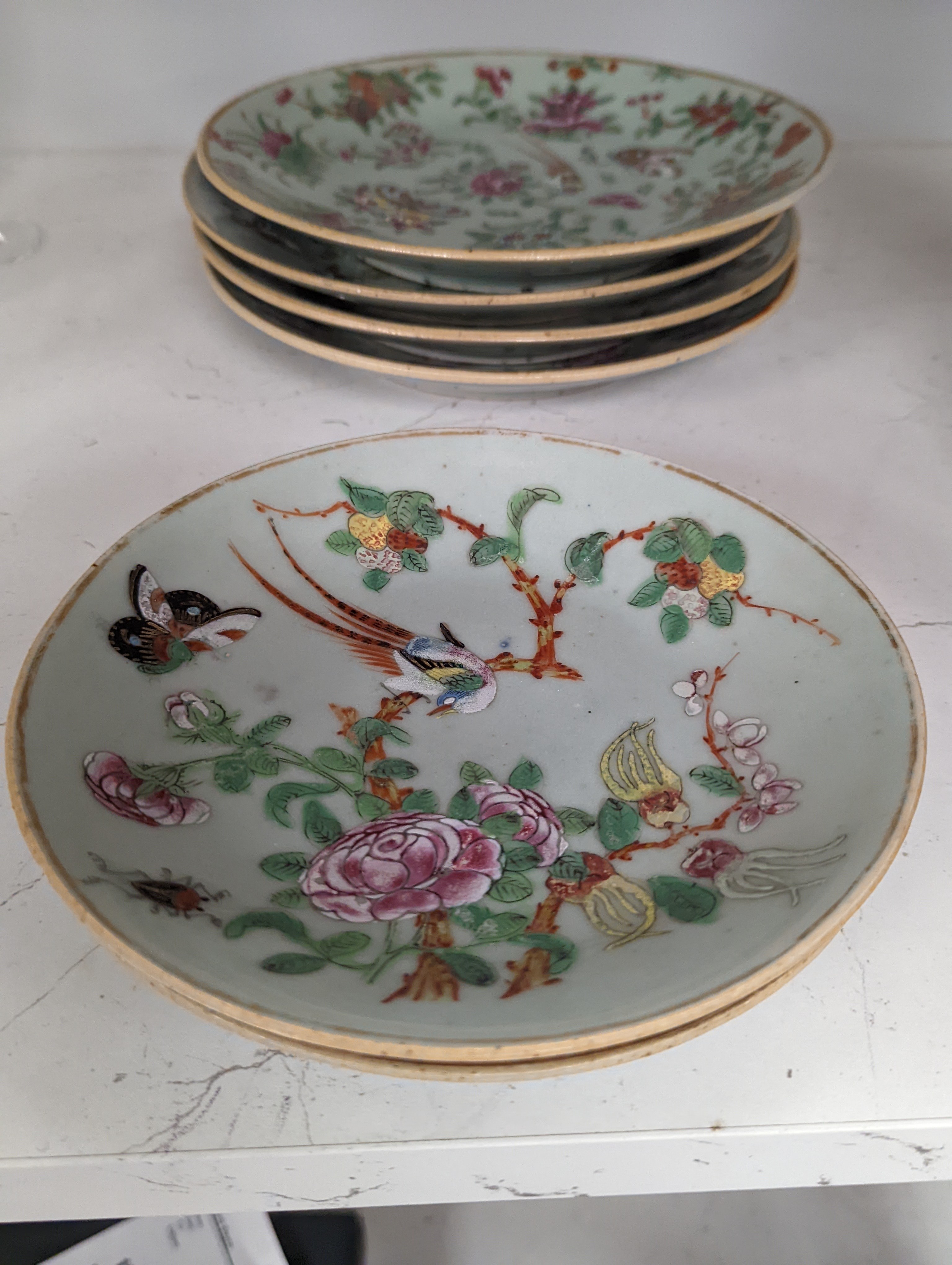 Eleven Chinese celadon ground famille rose plates, mid 19th century 22cm